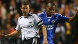 Roar Strand (left) vies with Chelsea's Florent Malouda at Stamford Bridge