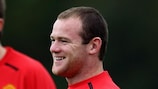 Wayne Rooney enjoys a joke with Michael Carrick in training on Monday