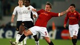 Roma centre-back Philippe Mexes vies with Louis Saha
