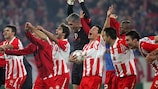 Olympiacos celebrate reaching the last 16