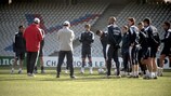 Perrin talks to his players at the Stade de Gerland