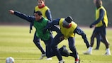 Theo Walcott and William Gallas tussle in training