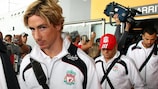 Fernando Torres and his Liverpool team-mates arrive in Liege