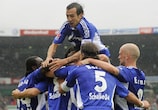 Schalke players celebrate their late equaliser against Bremen