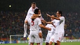 Daniel Van Buyten is mobbed by his team-mates after putting Bayern ahead
