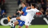 Basel's David Abraham vies with Jadson of Shakhtar on Matchday 1