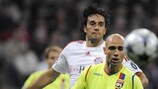 Bayern's Luca Toni chases down Lyon defender Cris