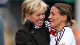 Sandra Smisek (right) is embraced by Germany coach Silvia Neid after bowing out with a goal