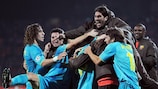 Barcelona celebrate their added-time goal in Donetsk