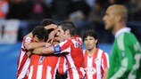 Simão is congratulated on his equaliser for Atlético as Pepe Reina (right) watches on