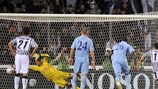 Tottenham goalkeeper Heurelho Gomes tries in vain to reach Antonio Di Natale's penalty