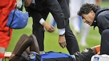 Sulley Muntari receives treatment after being injured against Genoa