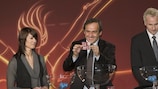 Michel Platini conducts the draw with help from tournament ambassador Satu Kunnas