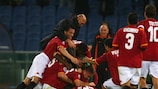 Mirko Vučinić is mobbed by his Roma team-mates