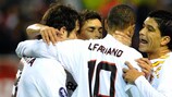 Luis Fabiano (centre) celebrates after scoring from the penalty spot