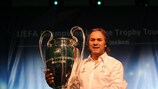 Trophy Tour Ambassador Rabah Madjer shows off the famous cup he won with Porto