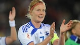 Anne Mäkinen applauds the Finland fans after the 1-0 defeat of Denmark