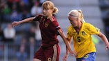 Elena Fomina (left) evades Sweden's Caroline Seger
