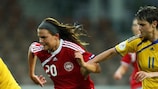 Nataliya Zinchenko attempts to dispossess Danish winger Katrine Veje