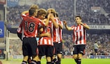 Fernando Llorente is mobbed after doubling Athletic's lead