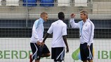 Karim Benzema (left) says he is enjoying a new role under Manuel Pellegrini (right)