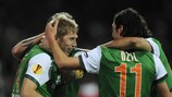 Aaron Hunt (left) celebrates with Mesut Özil after scoring Werder's first goal