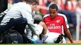 Theo Walcott of Arsenal receives treatment on Saturday