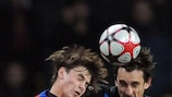 Manchester United captain Gary Neville jumps for a high ball with CSKA's Georgi Schennikov