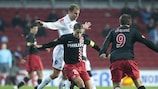 PSV's Ibrahim Afellay and Danko Lazović battle with FCK's Martin Vingaard