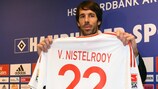 Ruud van Nistelrooy shows off his No22 jersey to the media