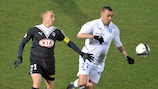 Matthieu Chalmé (left) vies with Auxerre striker Ireneusz Jeleń