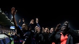 Lyon salute their travelling supporters at full time