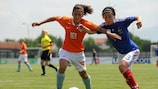 The Netherlands' Carmen Manduapessij vies with France left-back Caroline La Villa