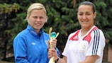 England skipper Gilly Flaherty and French counterpart Kelly Gadea pose with the trophy