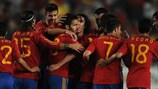 Spain celebrate one of their six goals against Poland