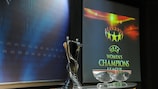The trophy is placed in the auditorium in Nyon ahead of today's draw