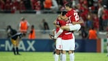 Hapoel Tel-Aviv players celebrate progress to the group stage