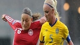 Mariann Gajhede Knudsen (left) up against Sweden's Caroline Seger in a 2010 World Cup play-off