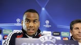 Lyon forward Jimmy Briand addresses the press beside his coach Claude Puel