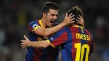 David Villa celebrates with Lionel Messi after putting Barcelona ahead against Panathinaikos