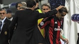Massimo Ambrosini (right) is comforted by coach Massimiliano Allegri after limping off
