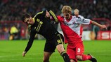 Liverpool striker Fernando Torres vies for possession with Utrecht's Mihai Neşu