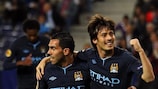 David Silva and Carlos Tévez celebrate during City's game against Salzburg on Matchday 1