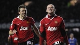 Rooney penalty sends United through