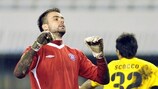 Hajduk goalkeeper Božidar Radošević rues his luck after Nacho Scocco's opener for AEK
