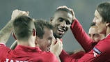 Douglas (centre) celebrates his equaliser on the night for Twente