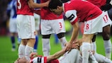 Robin van Persie lies injured at Wembley