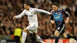 Cristiano Ronaldo races away from Lyon's Kim Källström