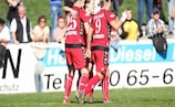Jennifer Oster (centre) celebrates scoring Duisburg's second equaliser last week with Alexandra Popp (left) and Inka Grings