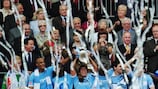 Manchester City striker Carlos Tévez lifts the FA Cup